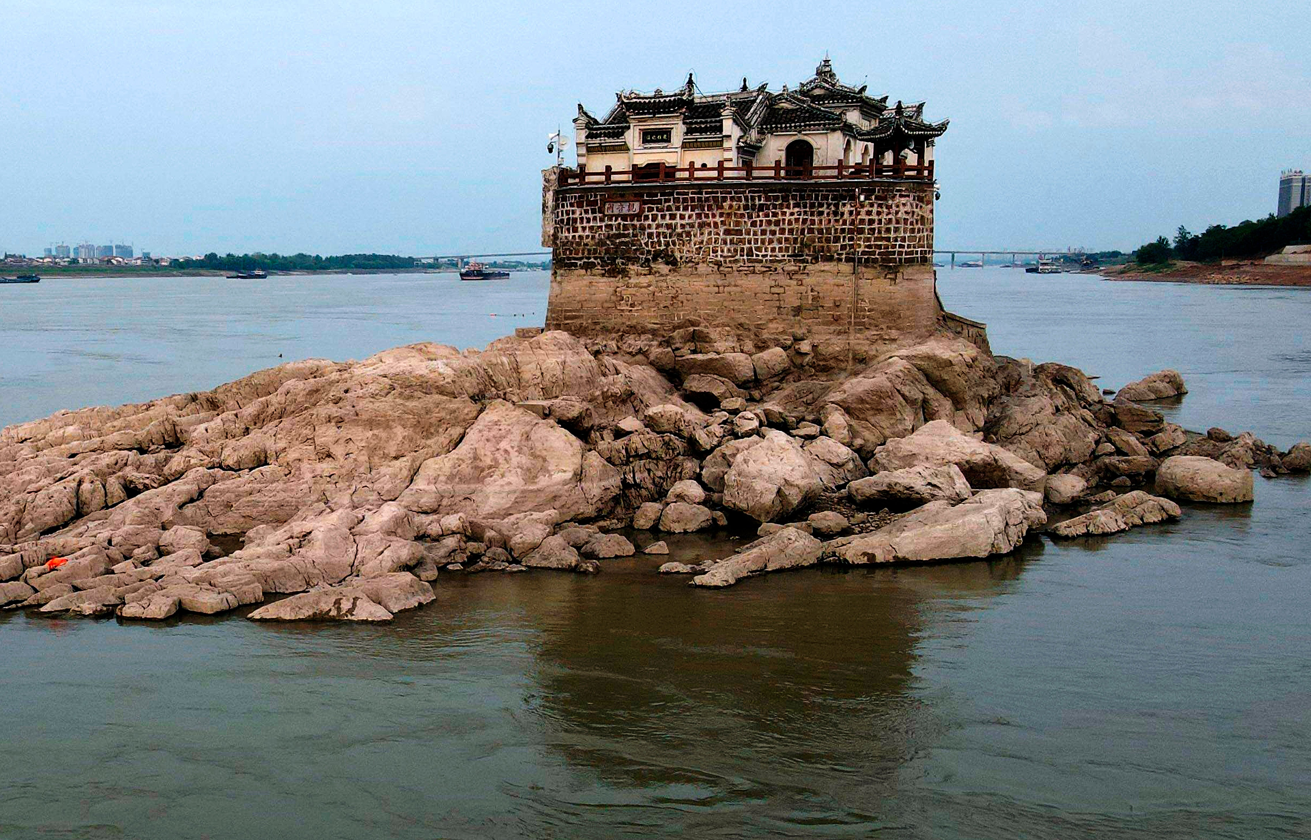 The Guanyin Temple on August 20. The large rock outcropping is normally covered by water. (Photo: FeatureChina, AP)