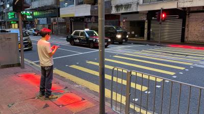 Hong Kong Upgrading Traffic Lights to Project Down on Distracted Texters, Keep Them From Walking Into Cars