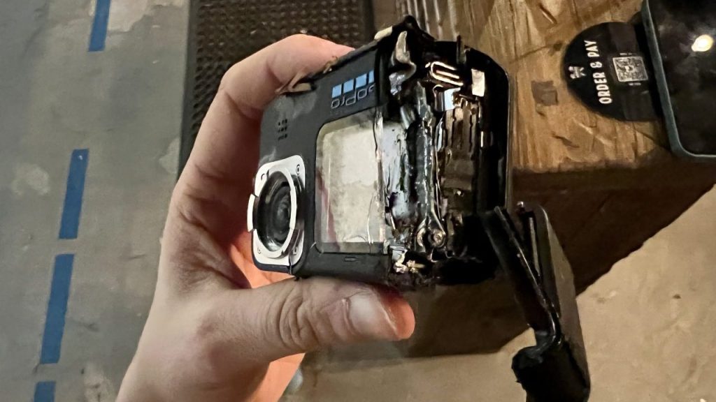 A GoPro with the edge sliced off, exposing the innards. It failed the GoPro durability test