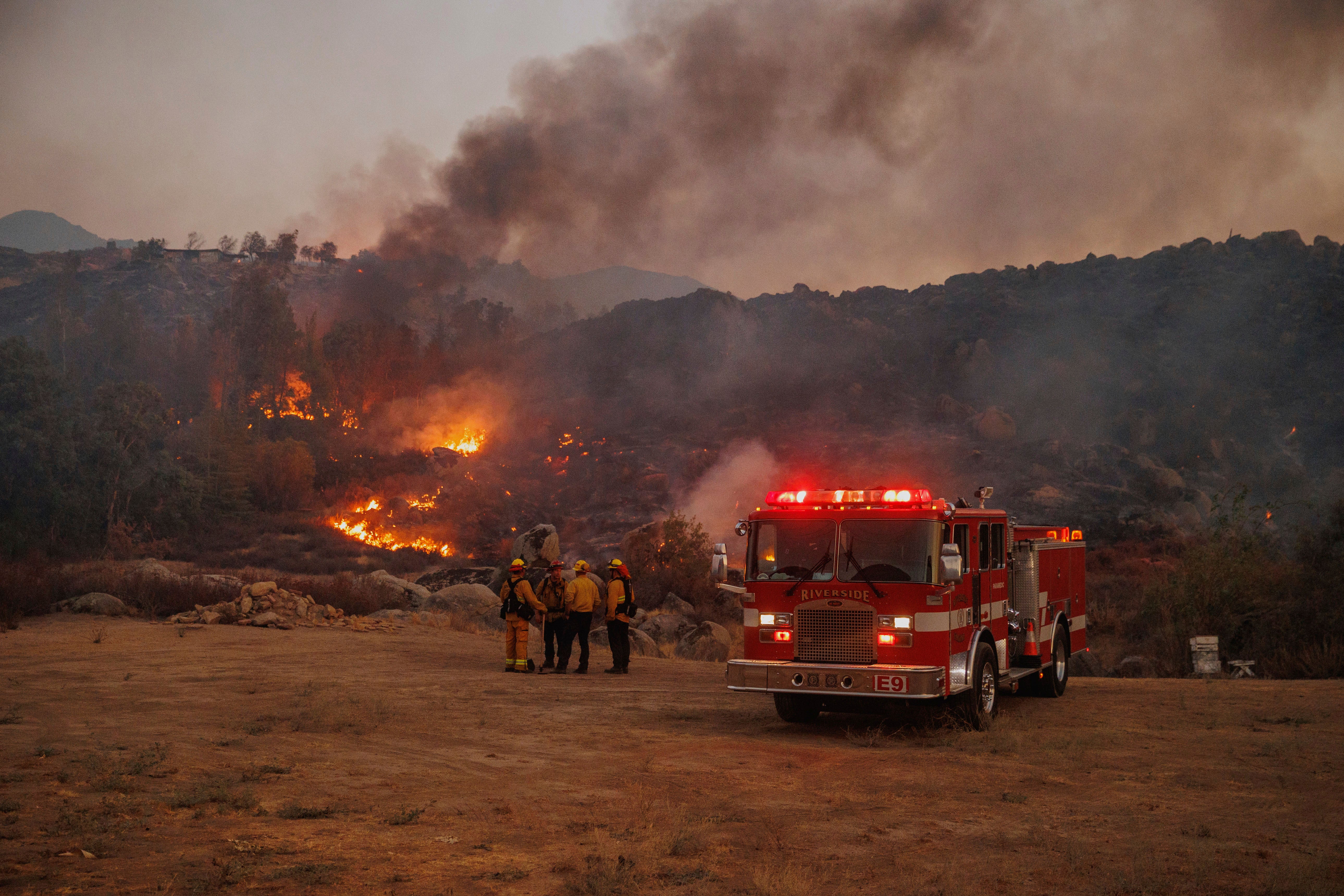 Firefighters stage in front of the Fairview Fire on Monday, Sept. 5, 2022, near Hemet, California.  (Photo: Ethan Swope, AP)