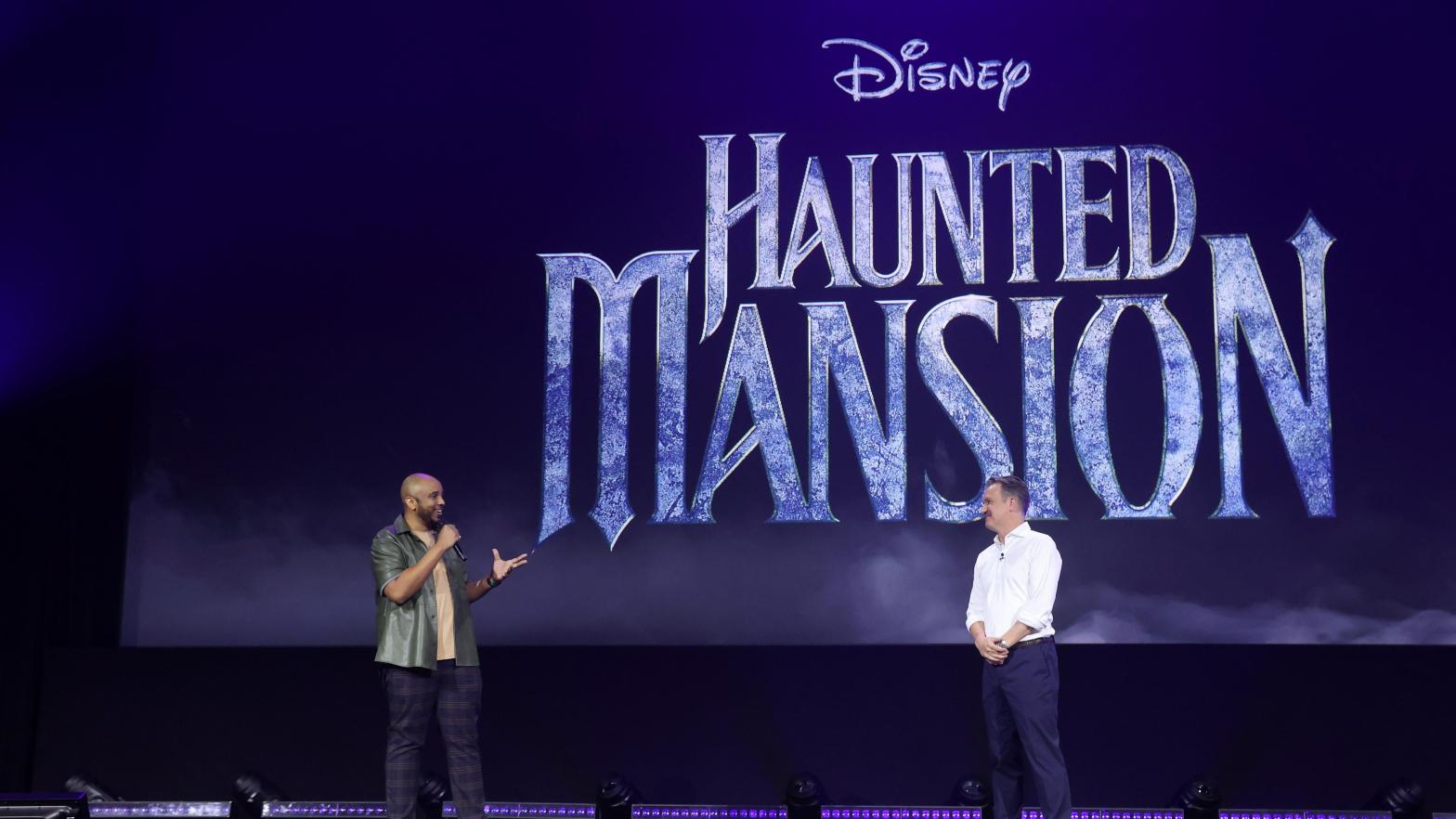 Justin Simien (left) talks haunts galore onstage at D23. (Photo: Jesse Grant/Getty Images for Disney, Getty Images)