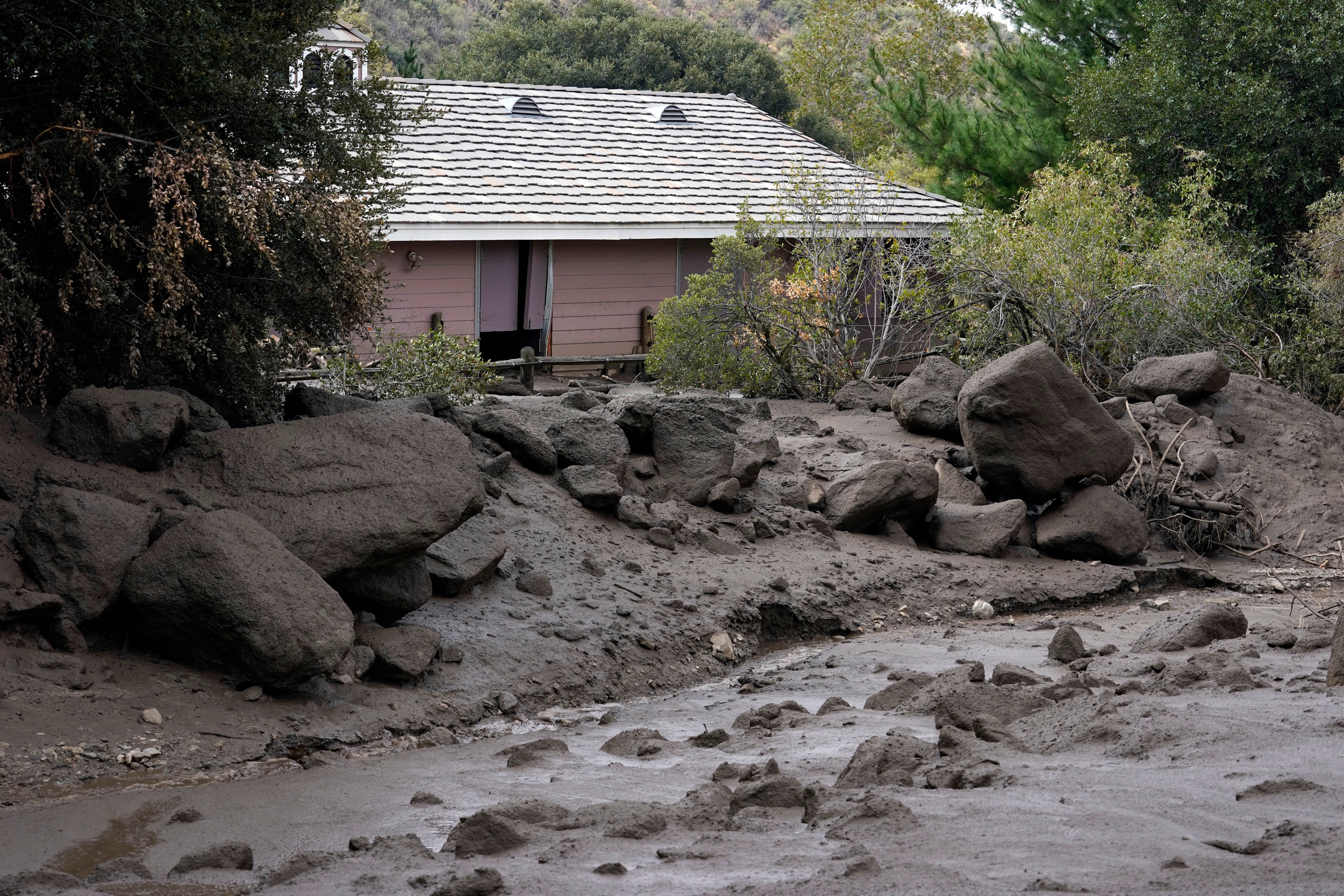 The front yard of a property is covered in mud in the aftermath of a mudslide Tuesday, Sept. 13, 2022, in Oak Glen, California. (Photo: Marcio Jose Sanchez, AP)