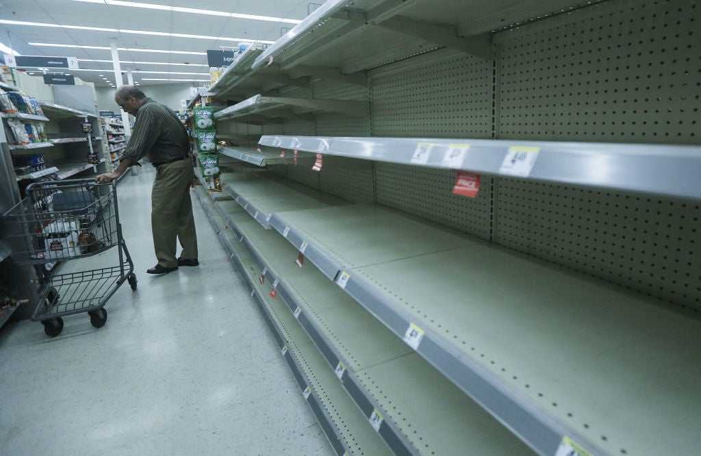 Beverage shelves stand mostly empty in a Walgreens store over three weeks after Hurricane Maria hit the island, on October 13, 2017 in San Juan, Puerto Rico. (Photo: Mario Tama, Getty Images)