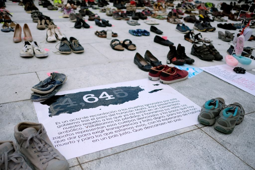 View of displayed shoes in memory of the more than 4,000 estimated deaths caused by Hurricane Maria in front of the Puerto Rican Capitol, in June 2018. U.S. researchers found that deaths were higher than officials had previously reported.  (Photo: RICARDO ARDUENGO/AFP, Getty Images)