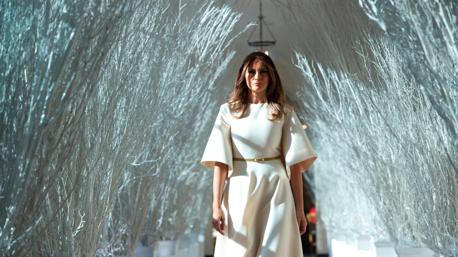 Former First Lady Melania Trump walks through the East Wing of the White House, which she decorated, during Christmas in 2017. (Photo: Saul Loeb / AFP, Getty Images)