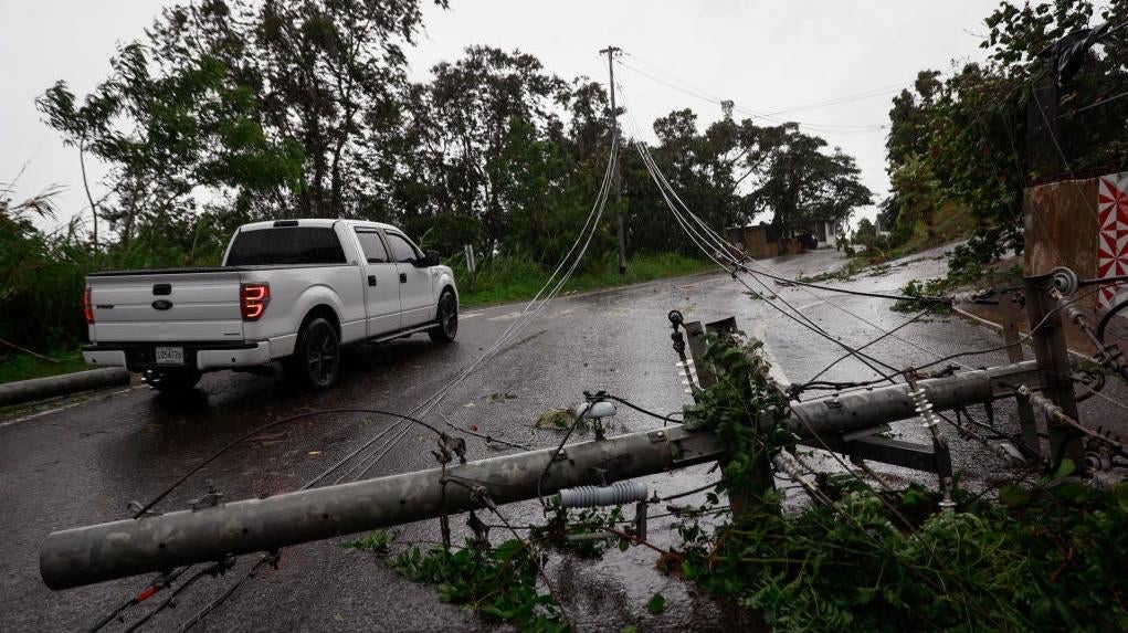 Downed power lines on road PR-743 in Cayey as the island awoke to a general power outage on September 19, 2022 in San Juan, Puerto Rico.  (Photo: Jose Jimenez, Getty Images)