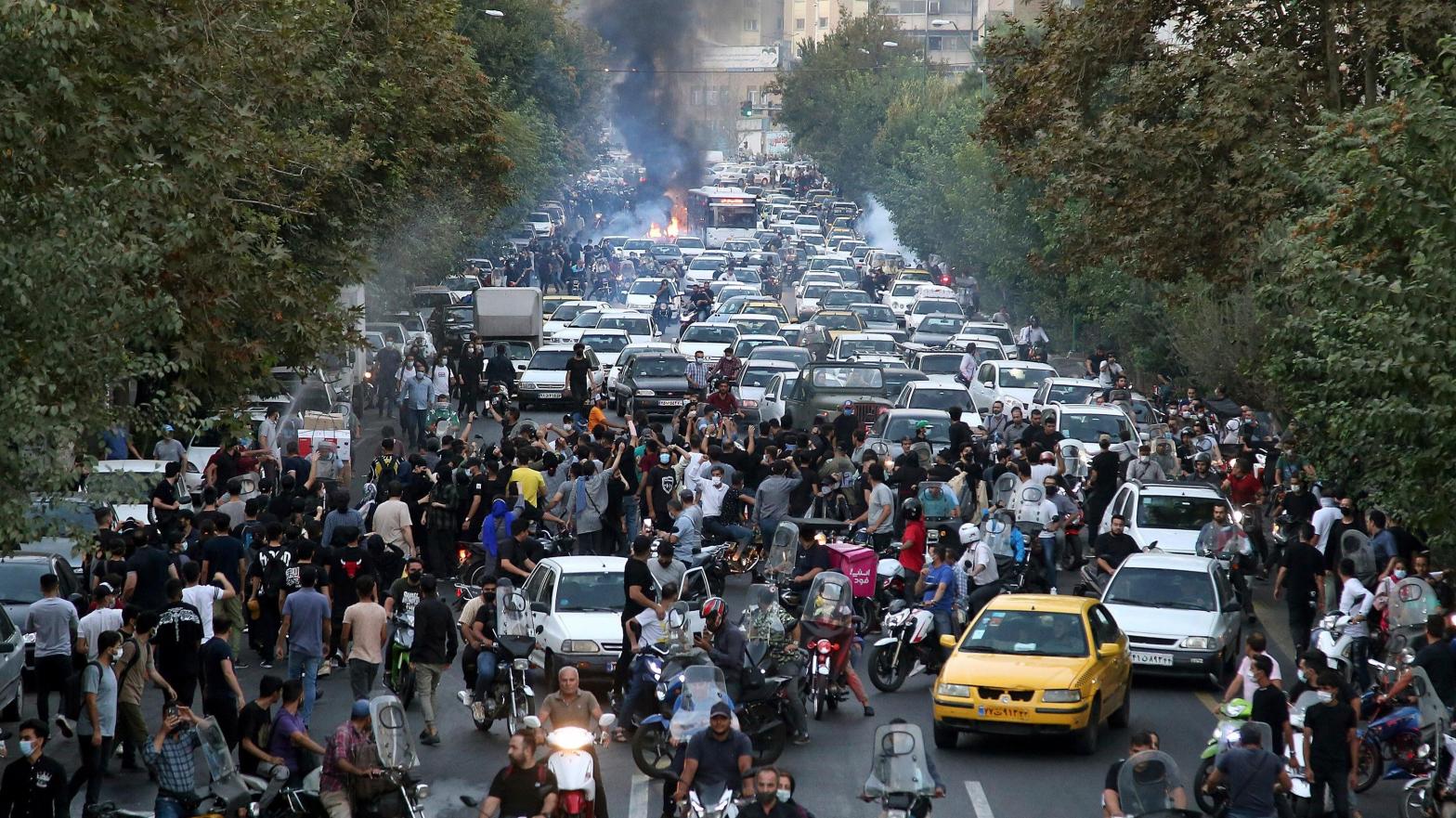 In this Sept. 21, 2022 photo taken by an individual not  employed by the Associated Press and obtained by the AP outside Iran,  protesters chant slogans during a protest over the death of a woman who  was detained by the morality police in downtown Tehran, Iran. (Photo: AP Photo, AP)