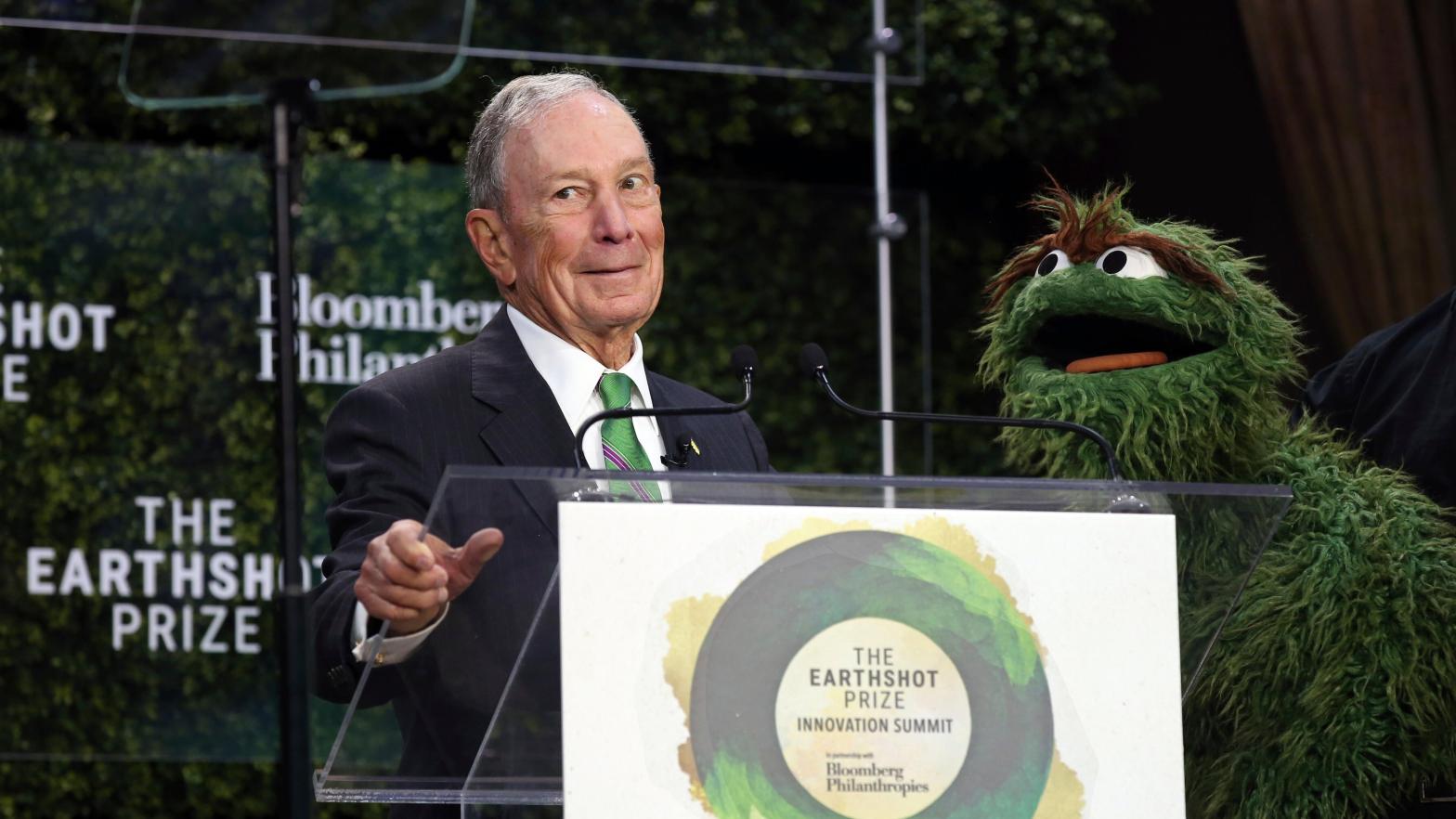 Bloomberg poses with Oscar the Grouch during a summit in New York City on Wednesday. (Photo: Bruce Gilbert, AP)
