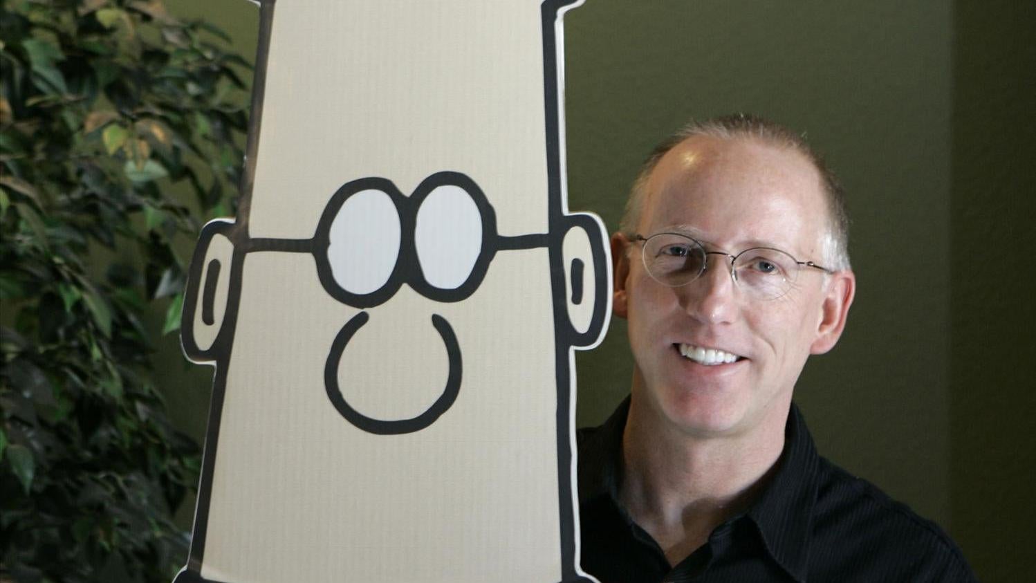 Adams poses with a Dilbert cutout in 2006. (Photo: AP Photo, AP)