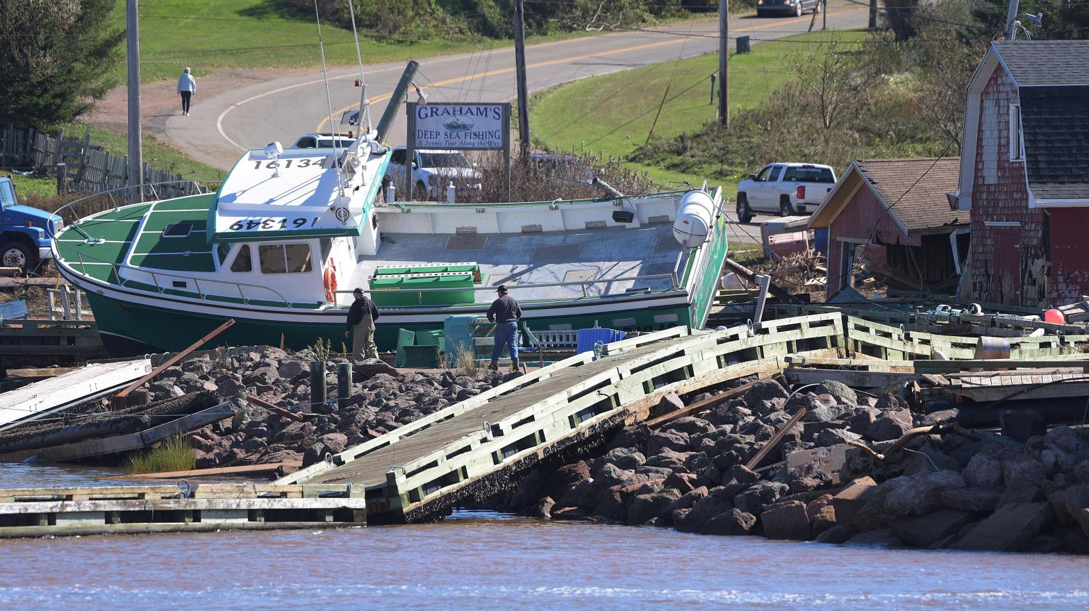 A boat washed ashore on Prince Edward Island in the aftermath of Hurricane Fiona on Sunday September 25. (Photo: Brian McInnis/The Canadian Press, AP)