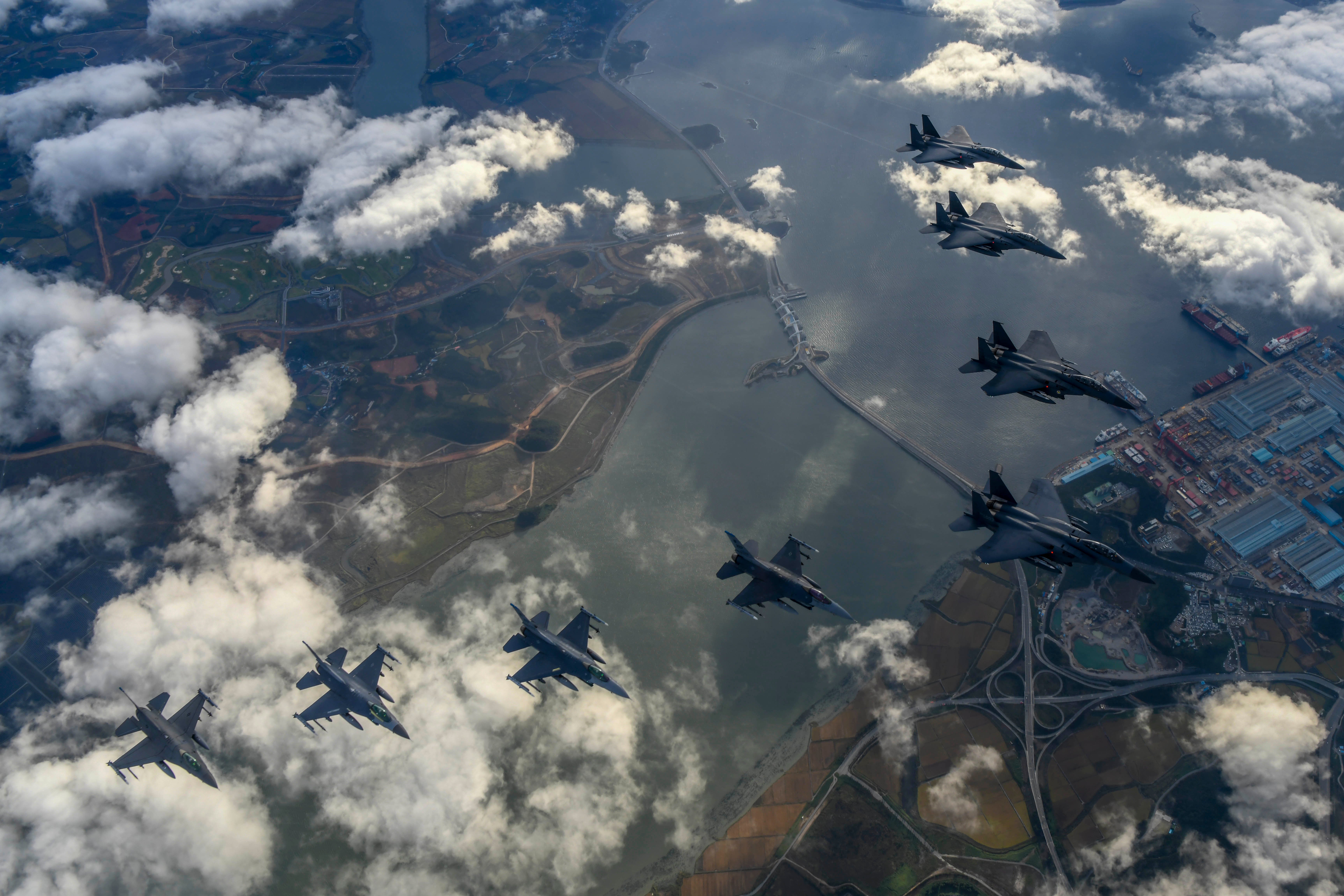 Four ROK Air Force F-15Ks and four U.S. Air Force F-16 fighters  participate in combined attack squadron flight.  (Photo: DVIDS / Jeremy Buddemeier)