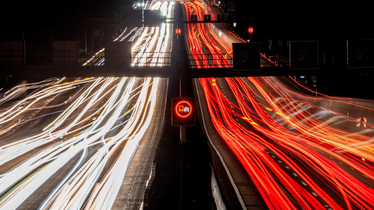 Long exposure photo shows traffic travelling along a highway, early Thursday, Oct. 6, 2022.  (Photo: Michael Probst, AP)