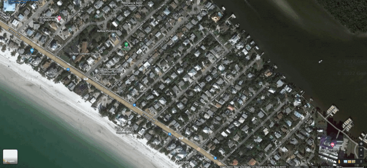 Beachfront businesses and homes were leveled by the storm. Elsewhere, debris fills the streets. (Gif: Gizmodo / NOAA / Google Maps)