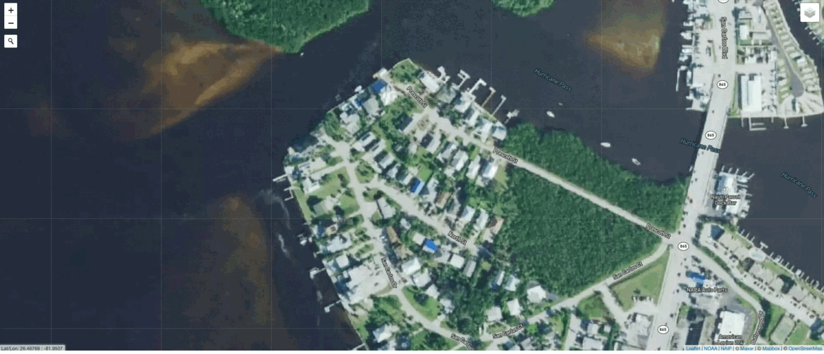 Houses in a neighbourhood on San Carlos Island are still standing, with their roofs intact. However, surrounding debris left by the storm signals possible damage. (Gif: Gizmodo / NOAA)