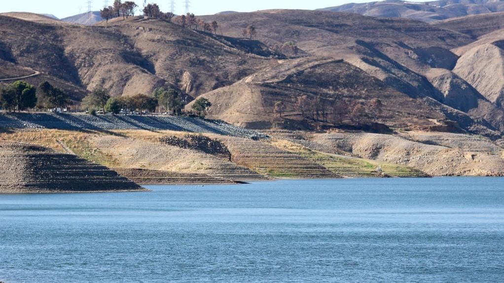 People fish along the Castaic Lake reservoir in Los Angeles County, on October 4, 2022 in Castaic, California. The reservoir, part of the State Water Project, is currently at 35 per cent capacity, below the historic average of 43 per cent.  (Photo: Mario Tama, Getty Images)