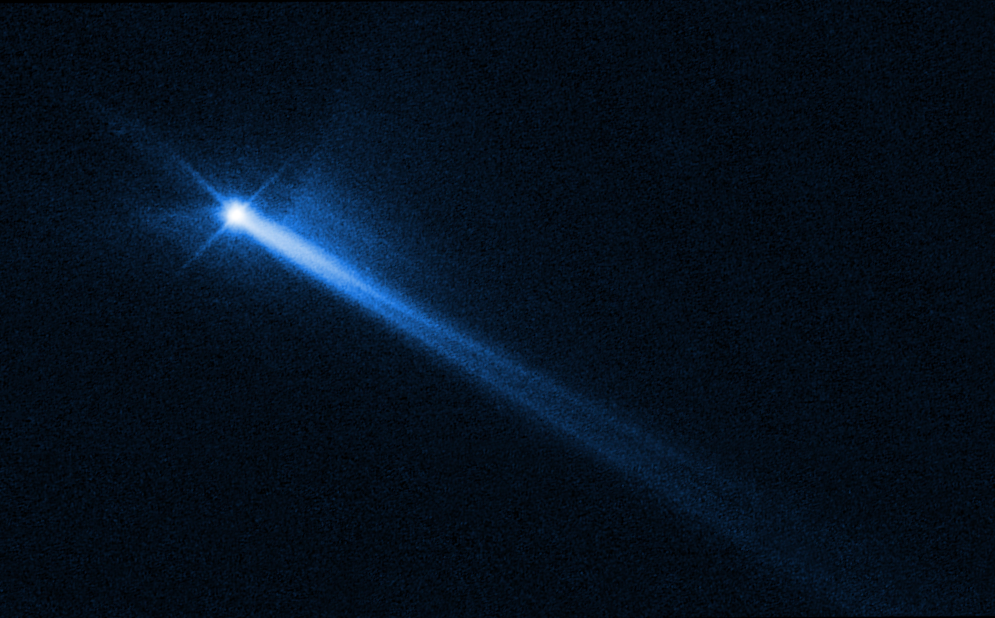 Hubble Space Telescope image showing the aftermath of the DART collision, including a comet-like tail emanating from the moonlet.  (Image: NASA/ESA/STScI/Hubble)