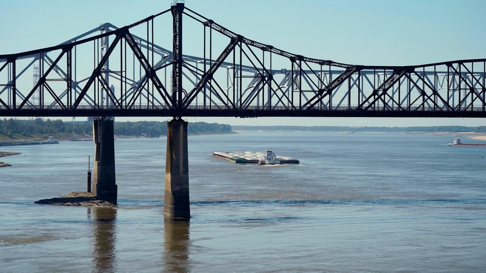 Low-water restrictions on the barge loads make for cautious navigation through the Mississippi River as evidenced by this tow passing under the Mississippi River bridges in Vicksburg, Tuesday, Oct. 11, 2022. (Photo: Rogelio V. Solis, Getty Images)