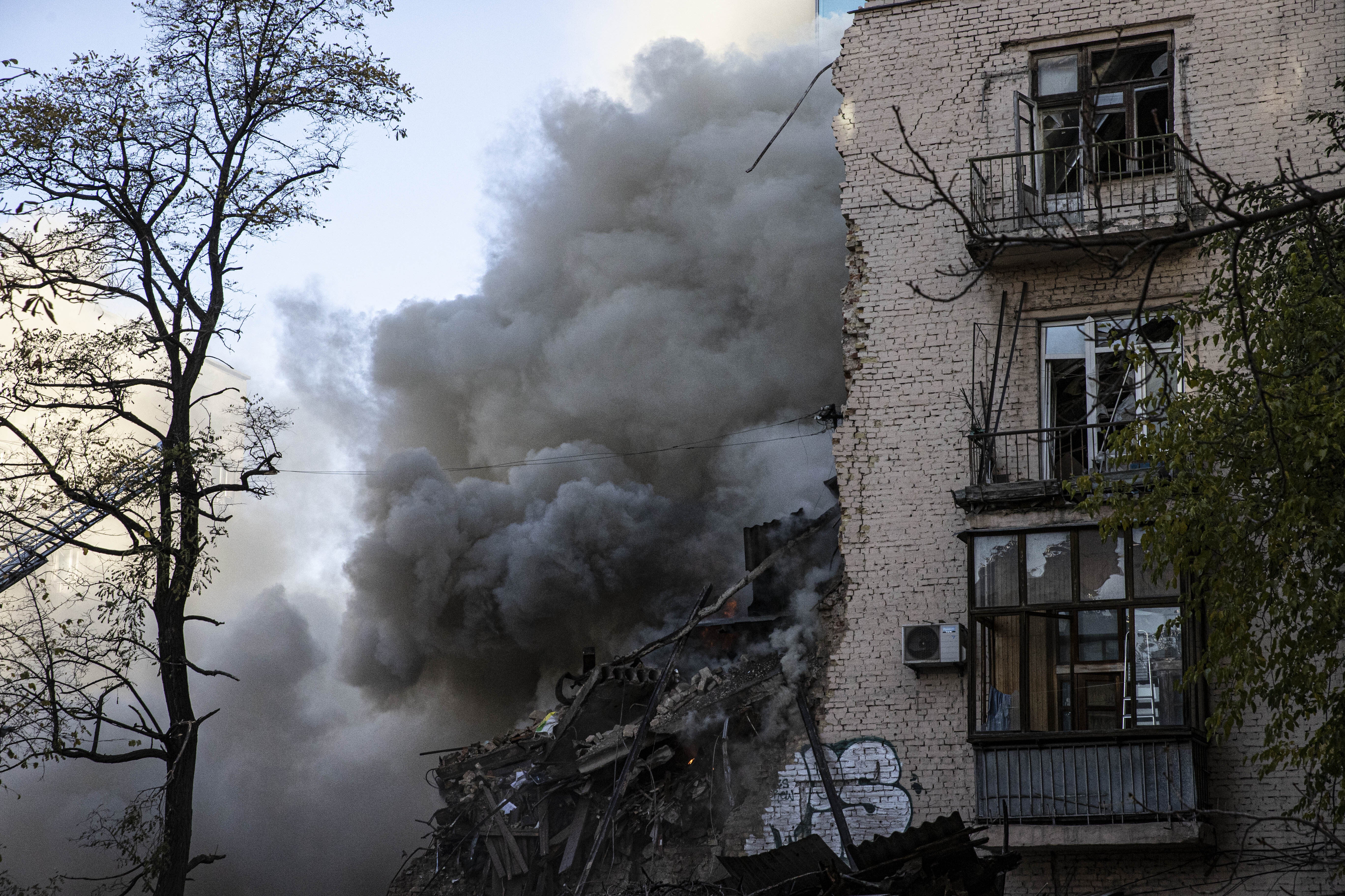 Smoke rises from a destroyed building after Russian attacks in Kyiv, Ukraine on October 17, 2022.  (Photo: Metin Aktas/Anadolu Agency, Getty Images)