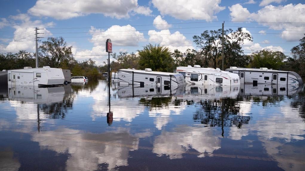 Trailers are inundated by floodwaters at the Peace River Campground on October 4, 2022 in Arcadia, Florida. (Photo: Sean Rayford, Getty Images)