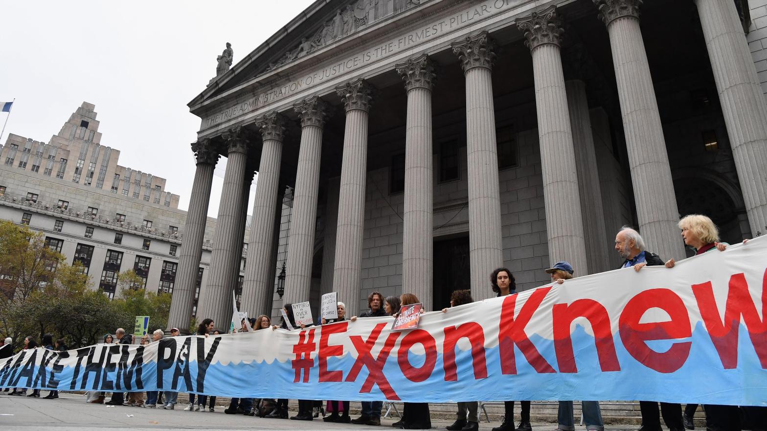 Climate activists protest on the fist day of the ExxonMobil trial outside the New York State Supreme Court building on October 22, 2019 in New York City. (Photo: ANGELA WEISS/AFP, Getty Images)