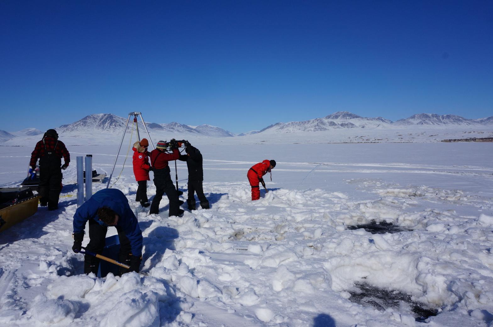 Graham Colby, one of the study scientists, took this photo of researchers drilling into Lake Hazen's ice to collect sediment samples in 2017. (Photo: Graham Colby, Getty Images)