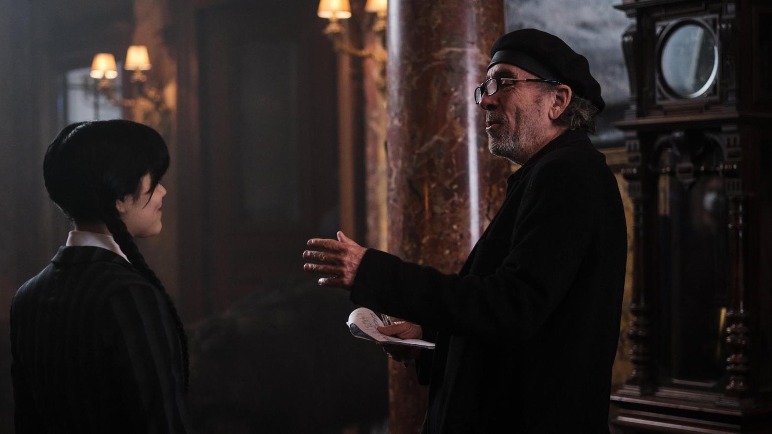Jenna Ortega as Wednesday Addams and Director Tim Burton on set (Image: Tomasz Lazar | Netflix)