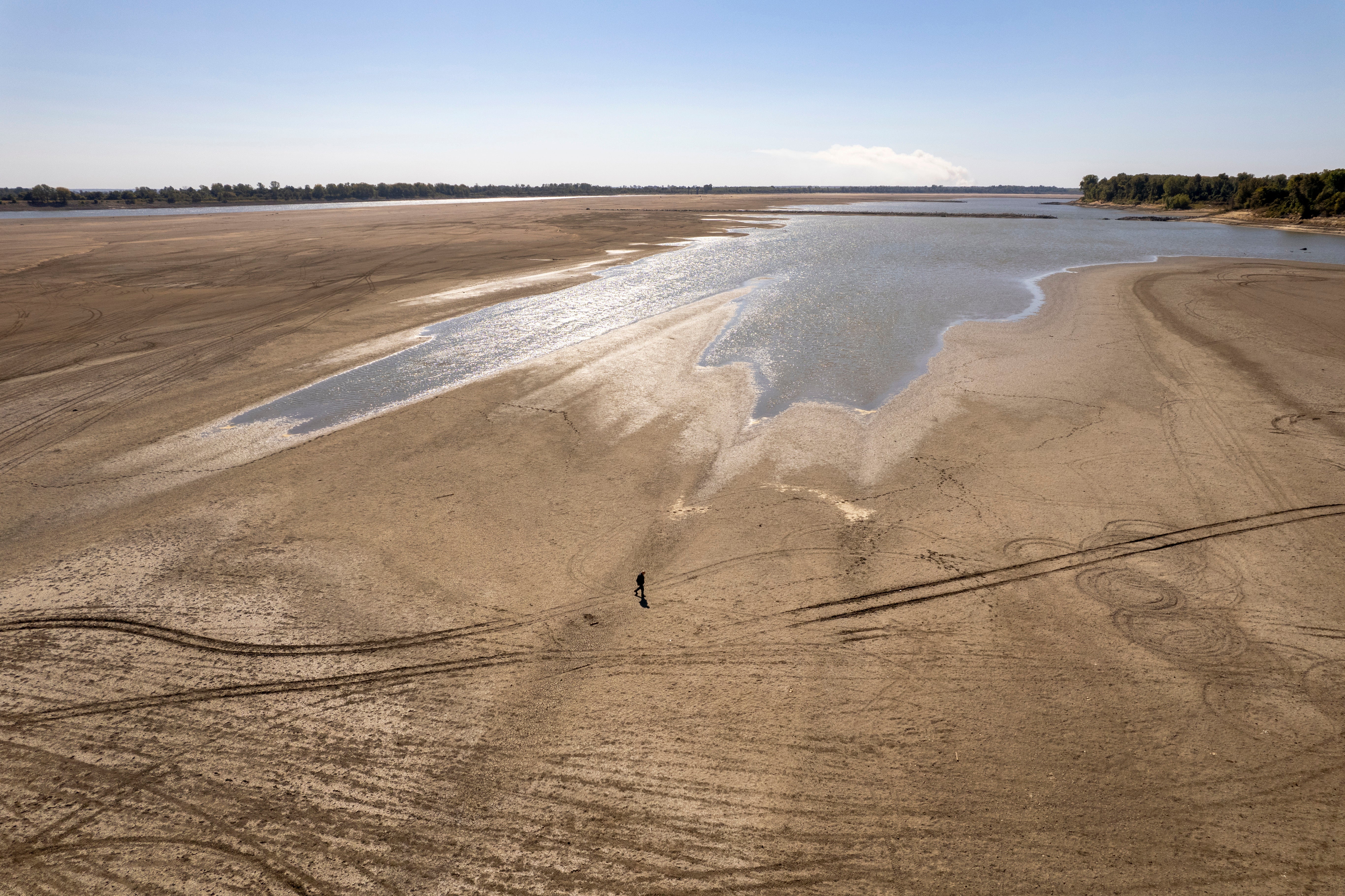James Isaacks walks where the normally wide Mississippi River would flow, Oct. 20, 2022, near Portageville, Mo. (Photo: Jeff Roberson, AP)