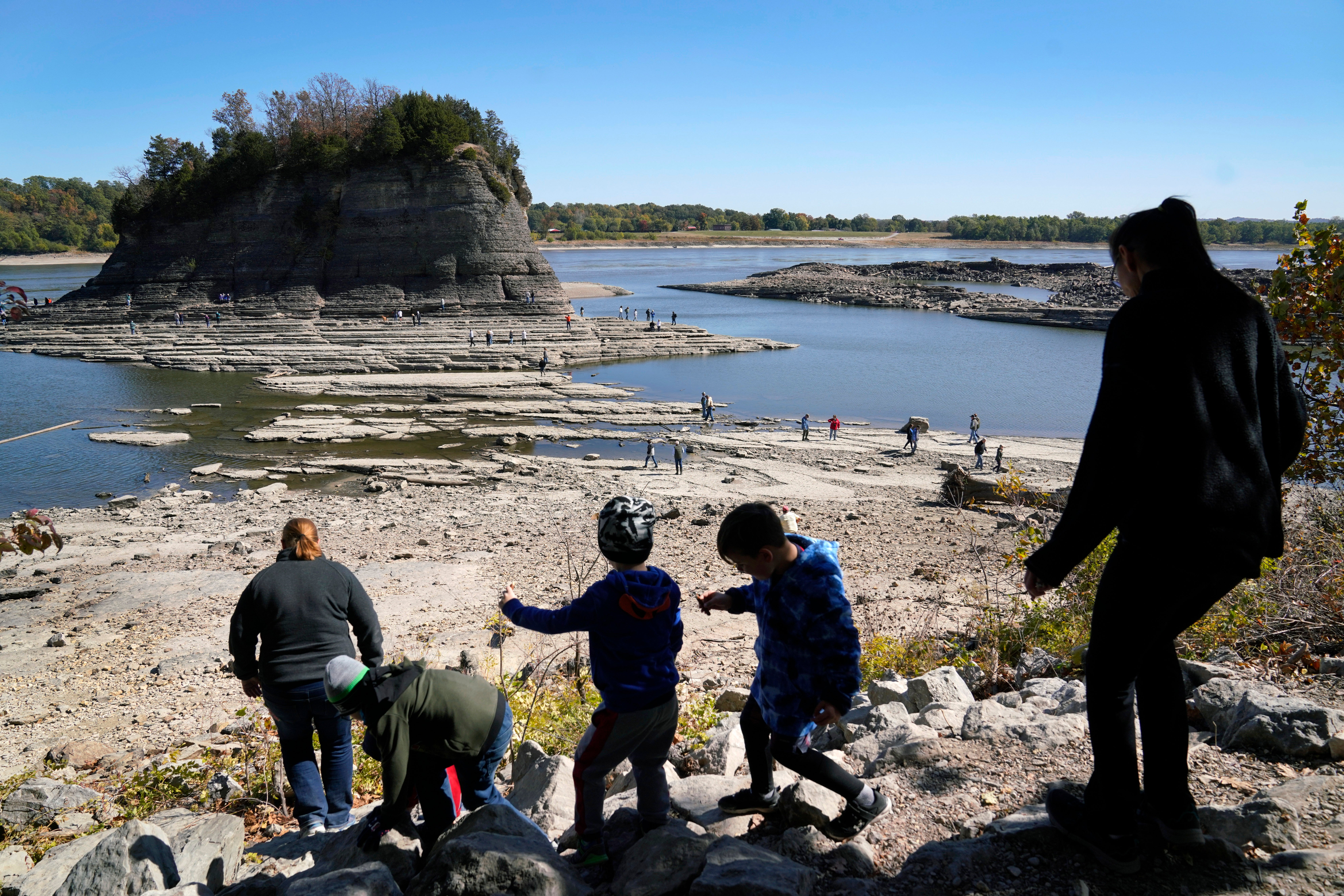 People walk toward Tower Rock to check out the attraction normally surrounded by the Mississippi River and only accessible by boat, Oct. 19, 2022, in Perry County, Mo.  (Photo: Jeff Roberson, AP)