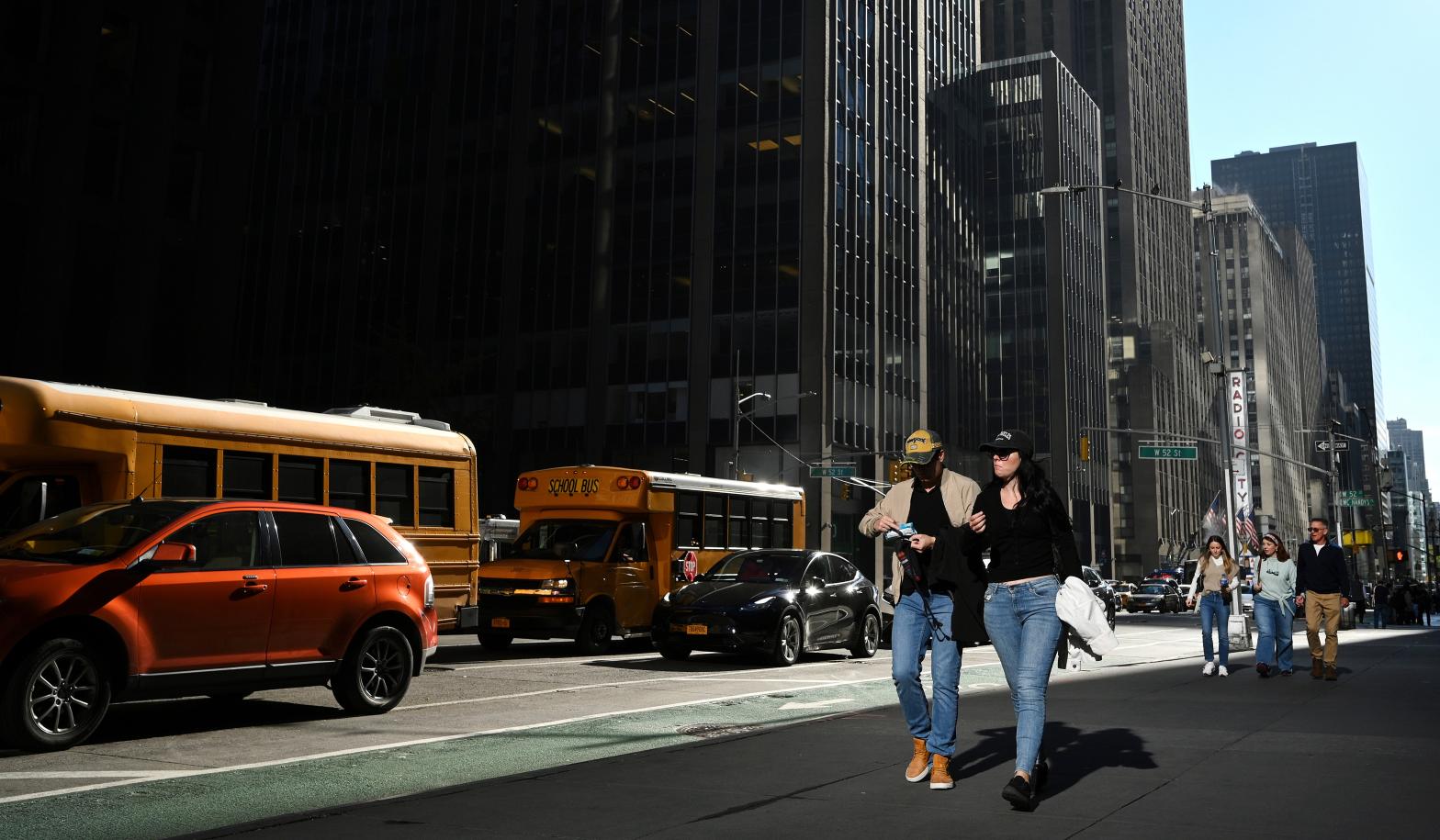 People walk down 6th Ave in Manhattan during unseasonably warm weather on November 2, 2022. (Photo: Anthony Behar/Sipa USA, AP)