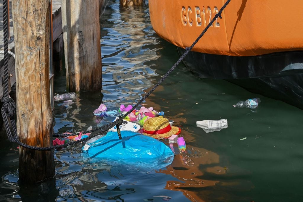 A view shows items from a Souvenirs stall that ended up in the Grand Canal in Venice due to strong winds, on August 18, 2022 as a result of bad weather.  (Photo: Andrea PATTARO / AFP, Getty Images)