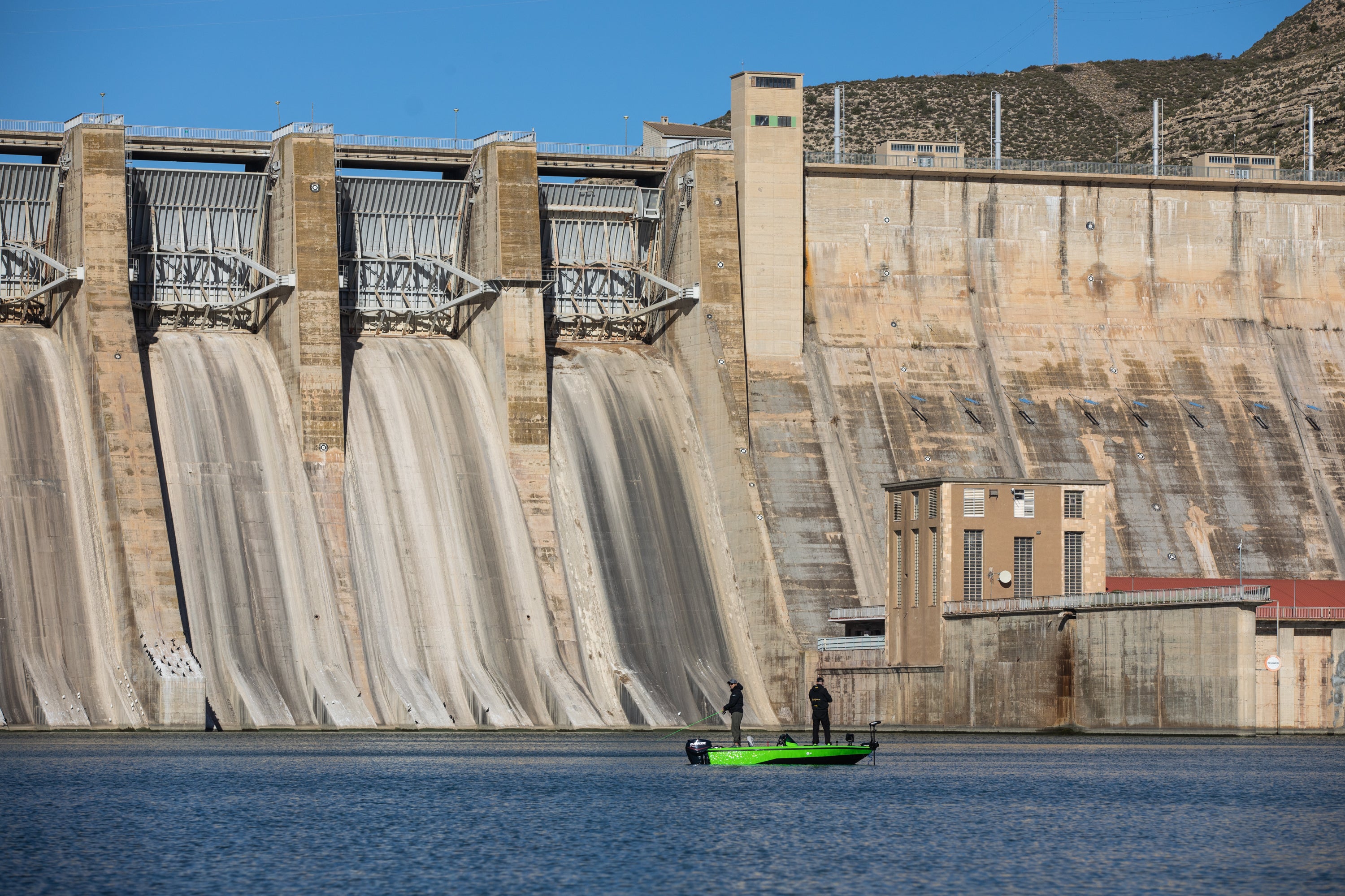 People fishing in front of the dam.  (Photo: Zowy Voeten, Getty Images)
