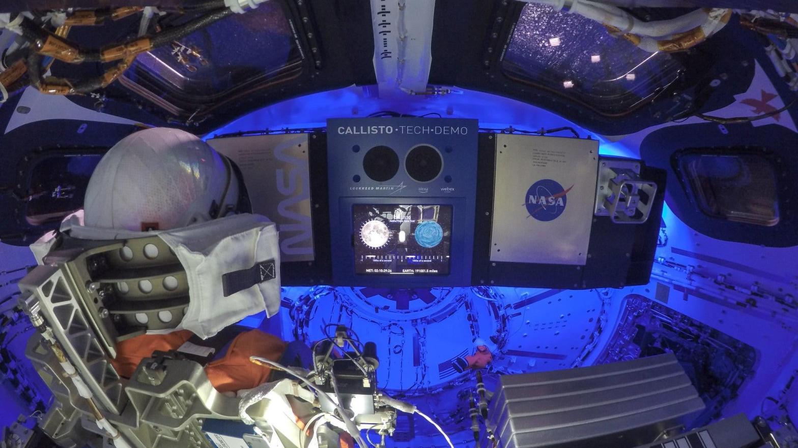 The current view inside Orion, featuring the Callisto tech demo. Also, check out the Snoopy plush doll, which is floating just to the bottom-right of centre.  (Photo: NASA)