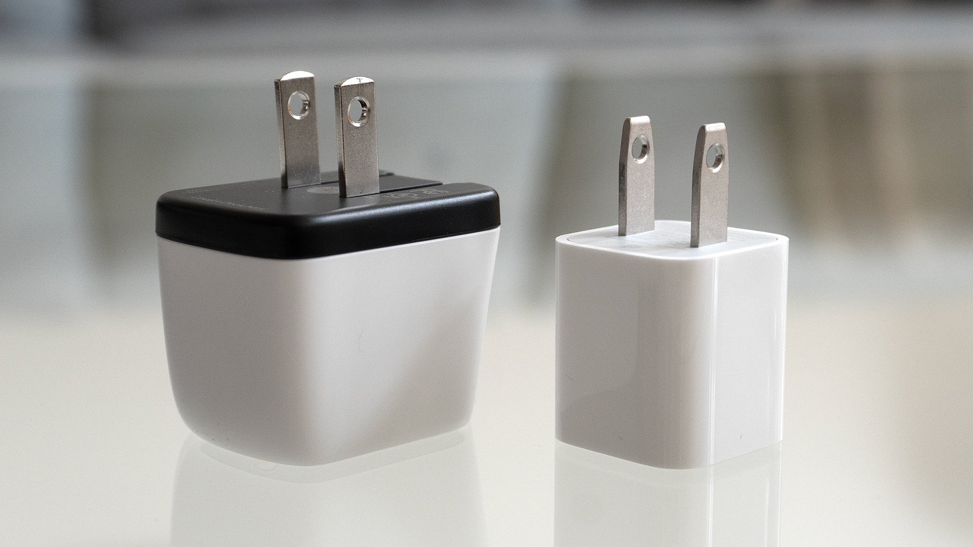 The Genki Covert Dock Mini is not much bigger than the 5W charger Apple used to ship with iPhones. (Photo: Andrew Liszewski | Gizmodo)
