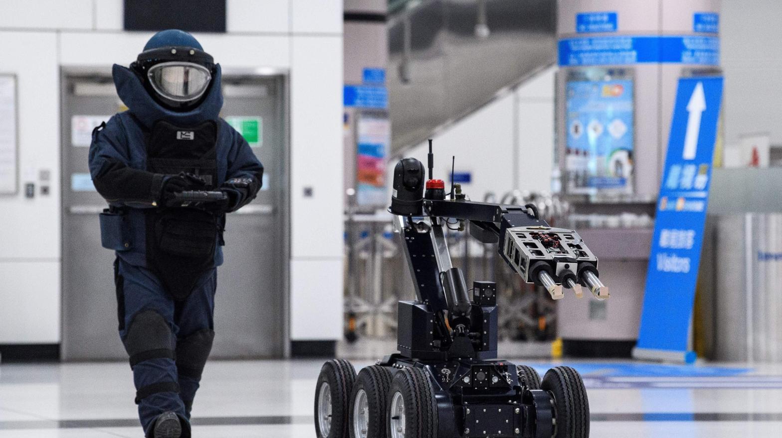 A Hong Kong police officer controls a bomb disposal robot in a counter-terrorism exercise in 2020. (Photo: Anthony Wallace / AFP, Getty Images)