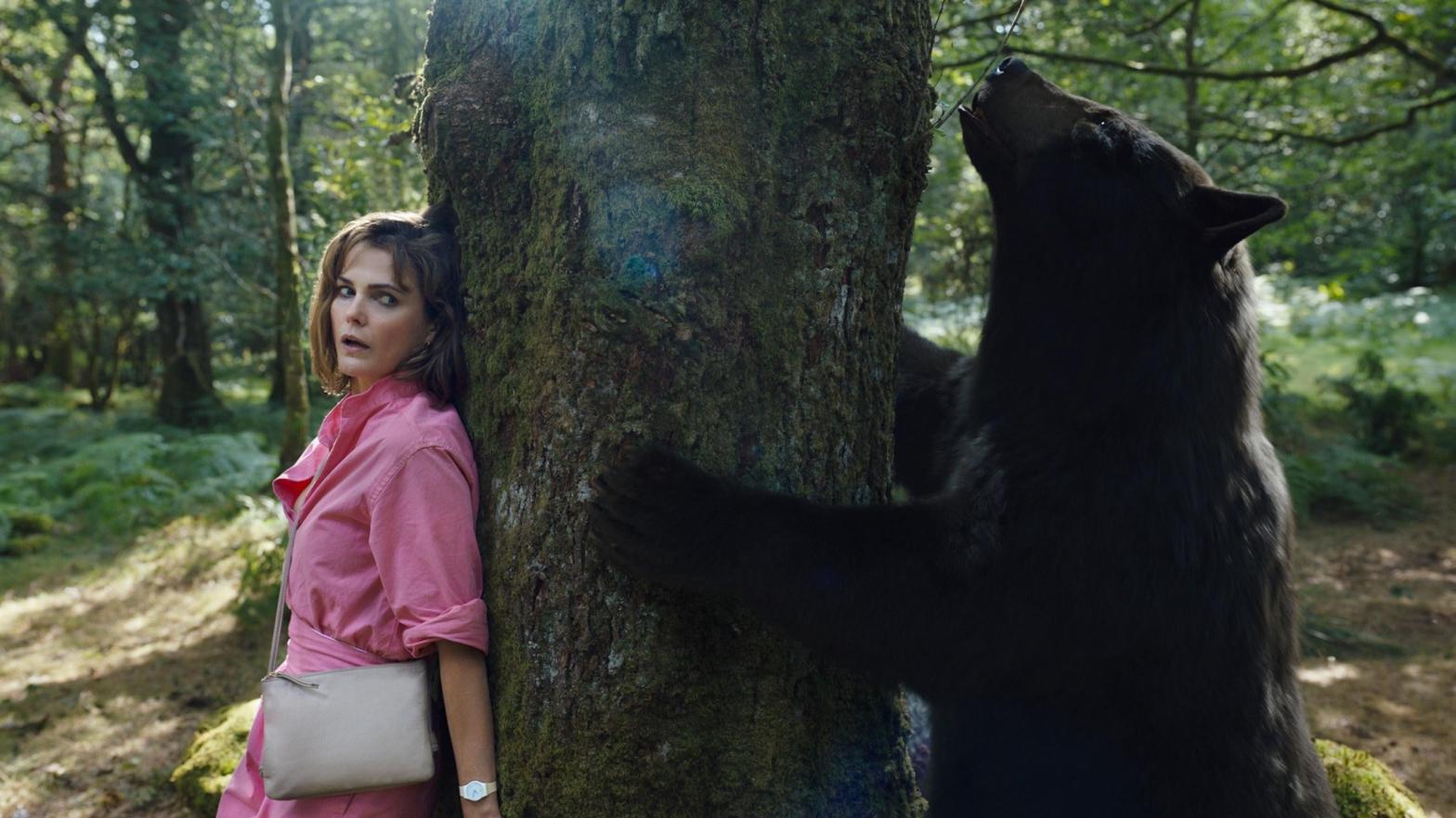 Keri Russell and the titular star of Cocaine Bear. (Image: Universal)