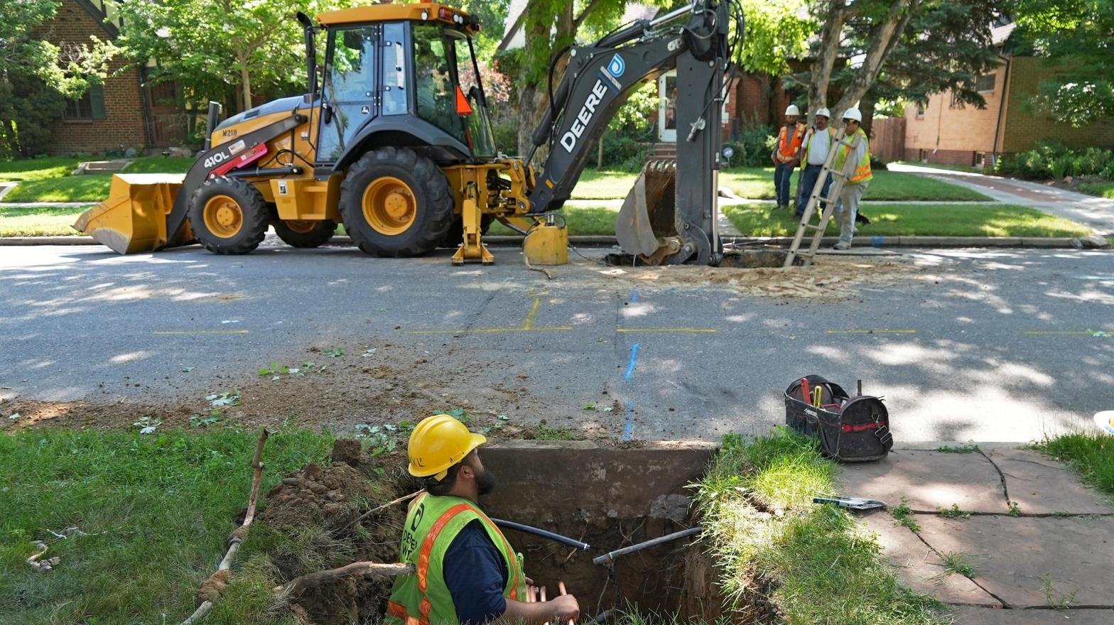 A Denver Water crew works to replace a lead water service line installed in 1927 with a new copper one at a private home on June 17, 2021, in Denver. (Photo: Brittany Peterson, AP)
