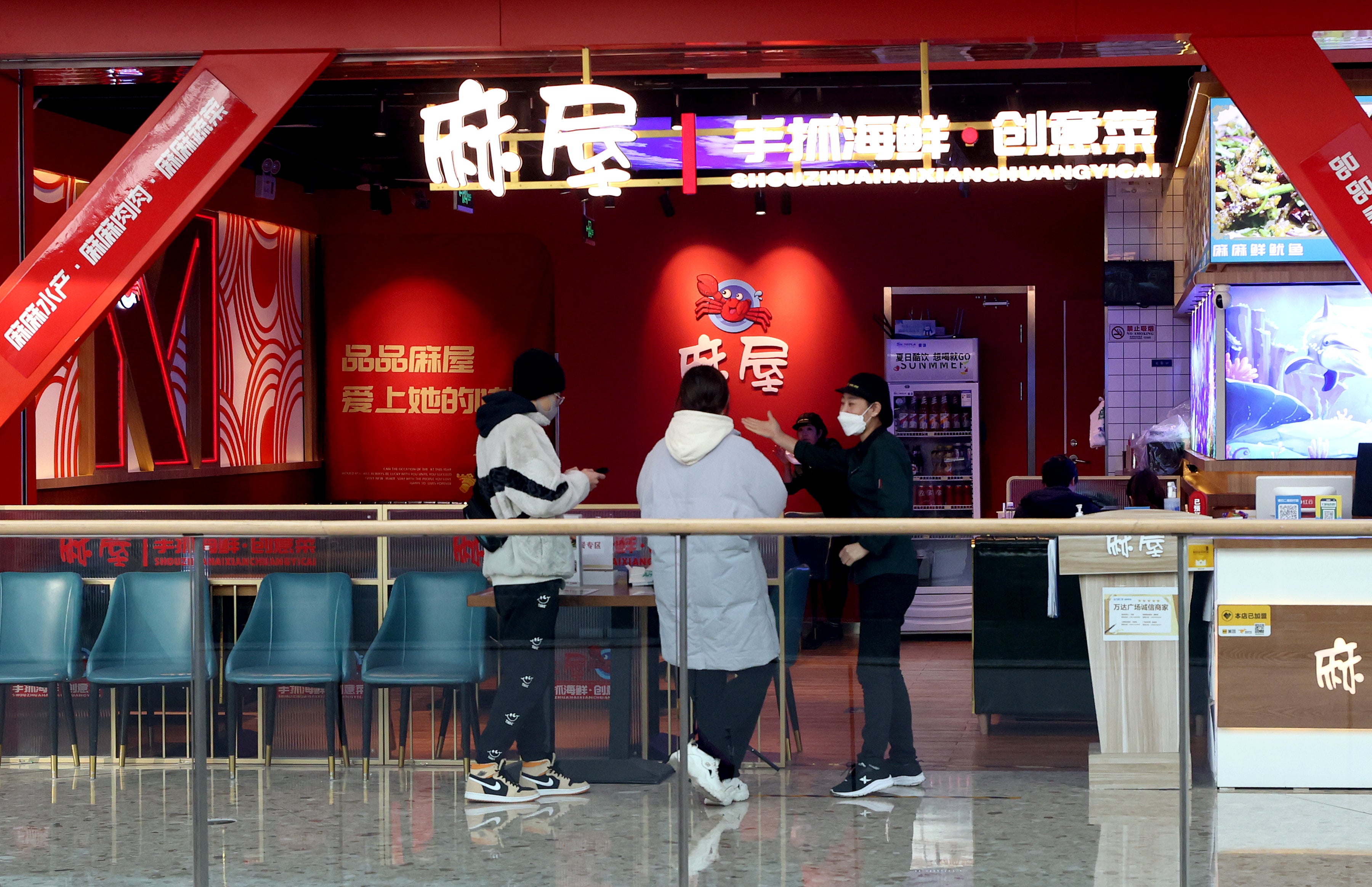 Customers enter a restaurant as Beijing no longer requires people to  show their negative nucleic acid testing results before entering public  places on December 6, 2022 in Beijing, China.  (Photo: Zhang Yu/China News Service, Getty Images)