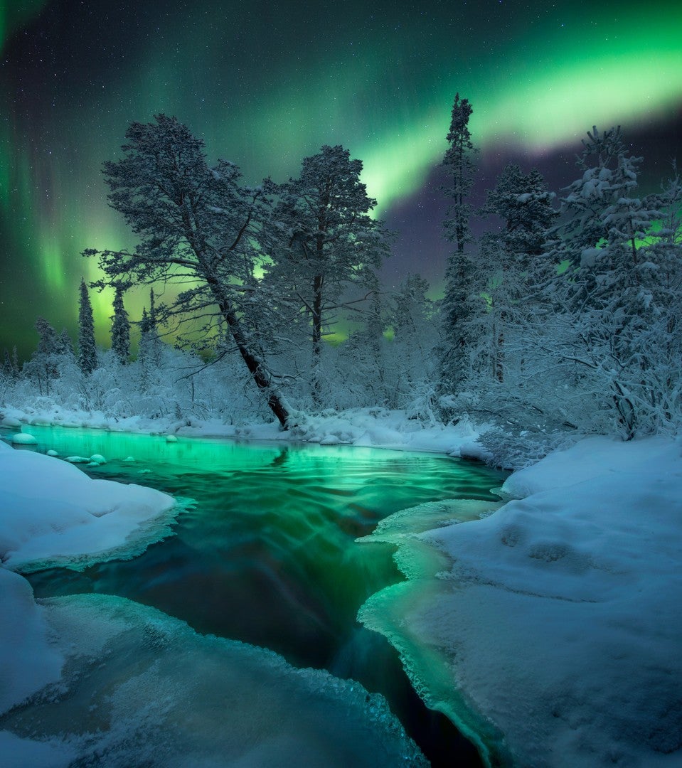 The Northern Lights over an icy river in Russia. (Photo: Aleksey & Anastasia R.)