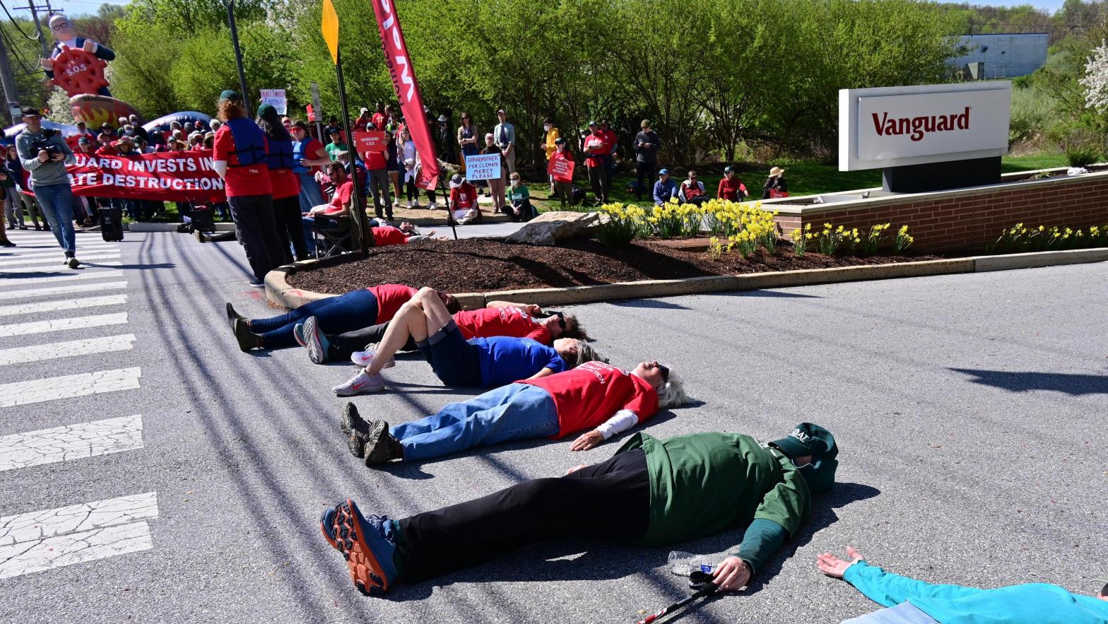 People lay down on the ground during the Vanguard SOS Campaign Fight For Our Future: Rally For Climate, Care, Jobs & Justice on April 22, 2022 in Malvern, Pennsylvania. (Photo: Lisa Lake, Getty Images)