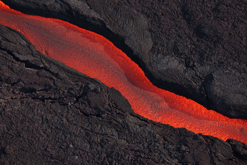 Lava flows from a fissure of Mauna Loa Volcano as it erupts on December 05, 2022 in Hilo, Hawaii.  (Photo: Justin Sullivan, Getty Images)