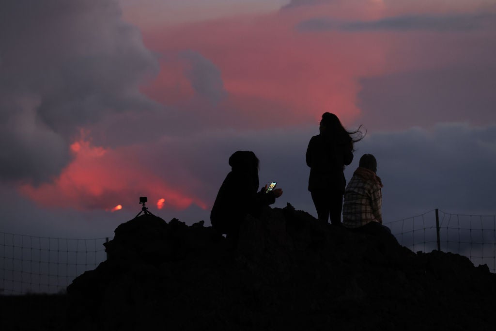 Clouds glow orange from the glow of lava that is flowing from the Mauna Loa volcano on December 03, 2022 near Hilo, Hawaii.  (Photo: Justin Sullivan, Getty Images)