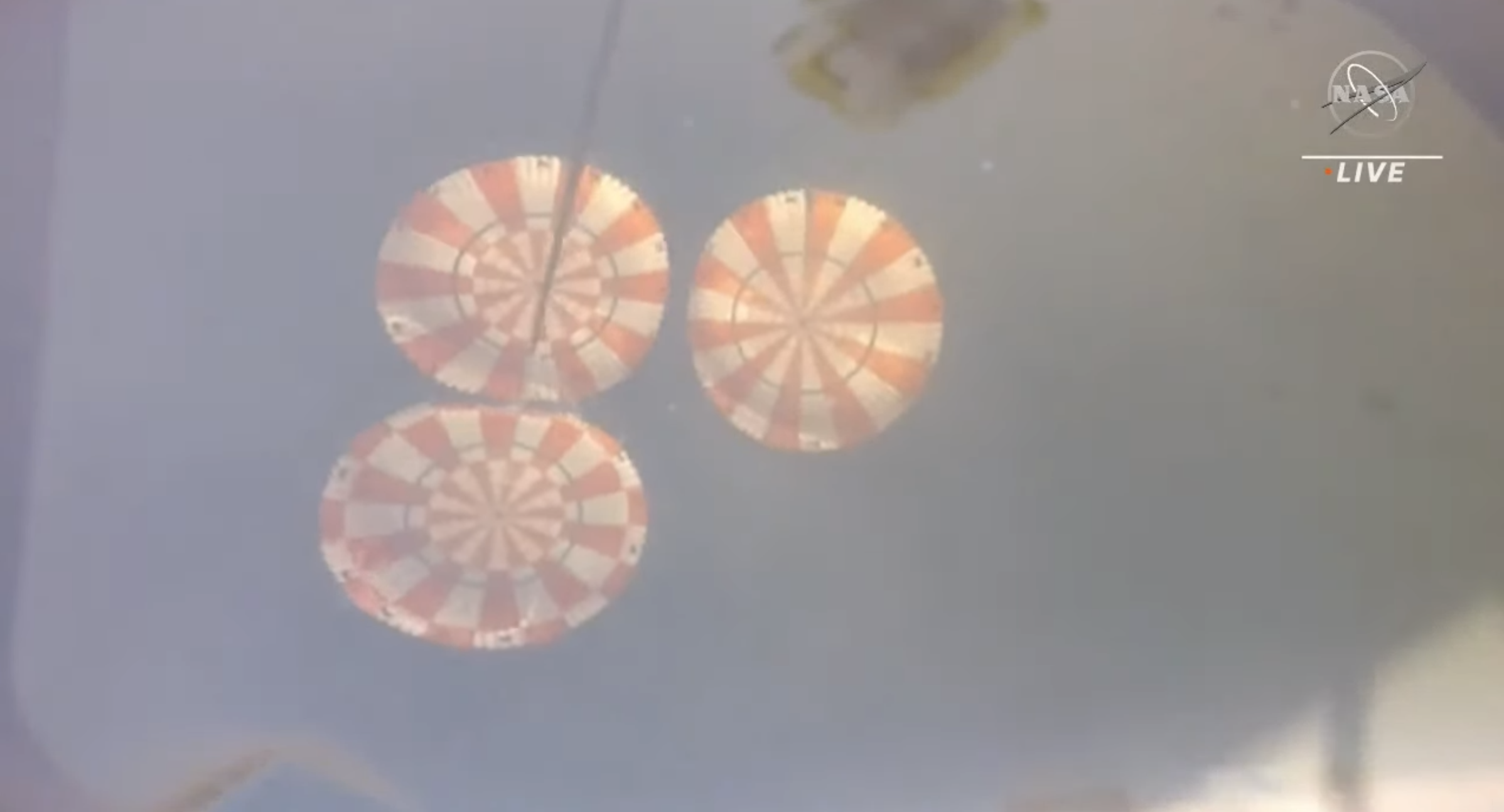 A view of Orion's three main parachutes.  (Screenshot: NASA TV)