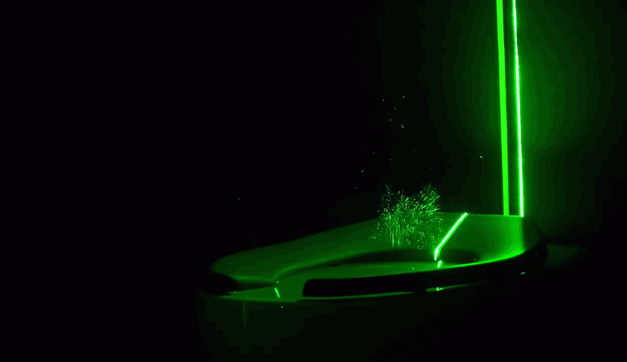 Researchers from University of Colorado Boulder created a thin curtain of laser light to visualise the toilet spray.  (Gif: John Crimaldi/Gizmodo)