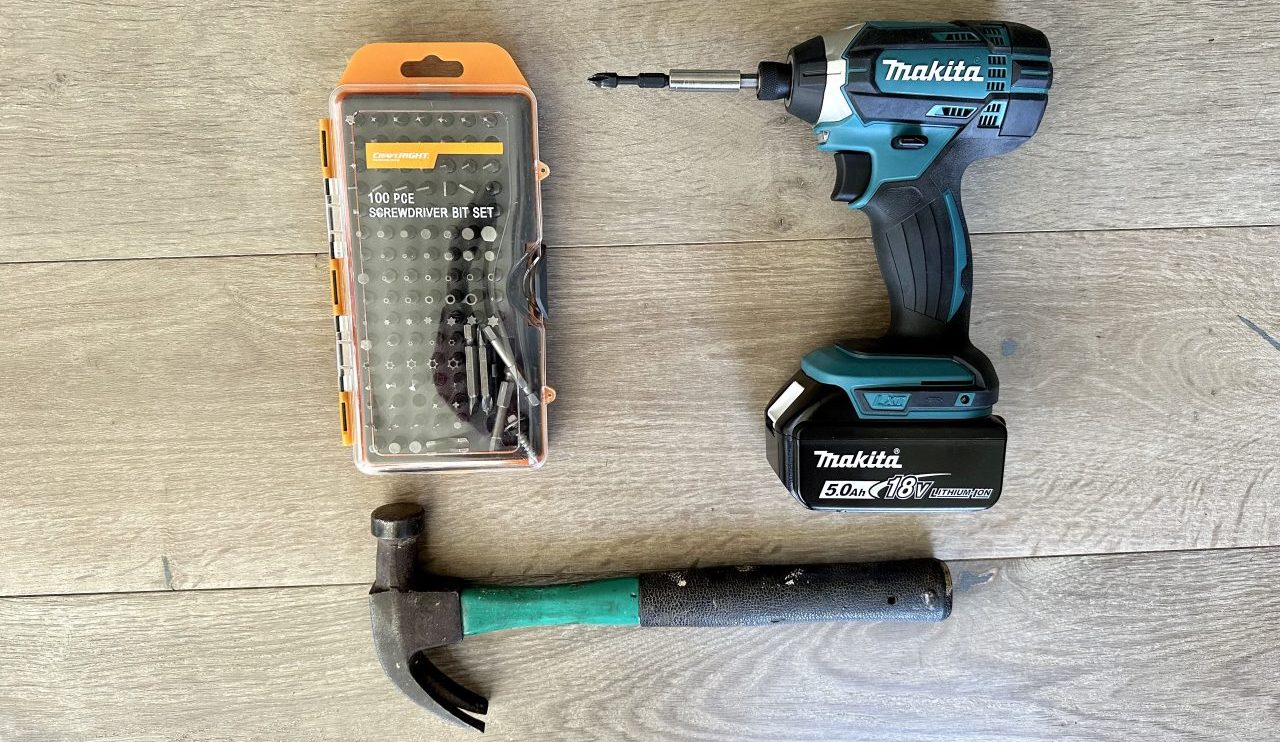 Hammer, screwdriver bits and a drill