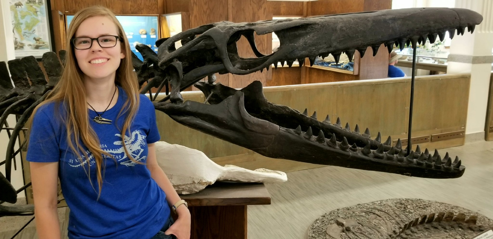 Amelia Zietlow with a cast of Mosasaurus conodon at the South Dakota School of Mines & Technology in Rapid City, SD. (Photo: Brady Holbach)