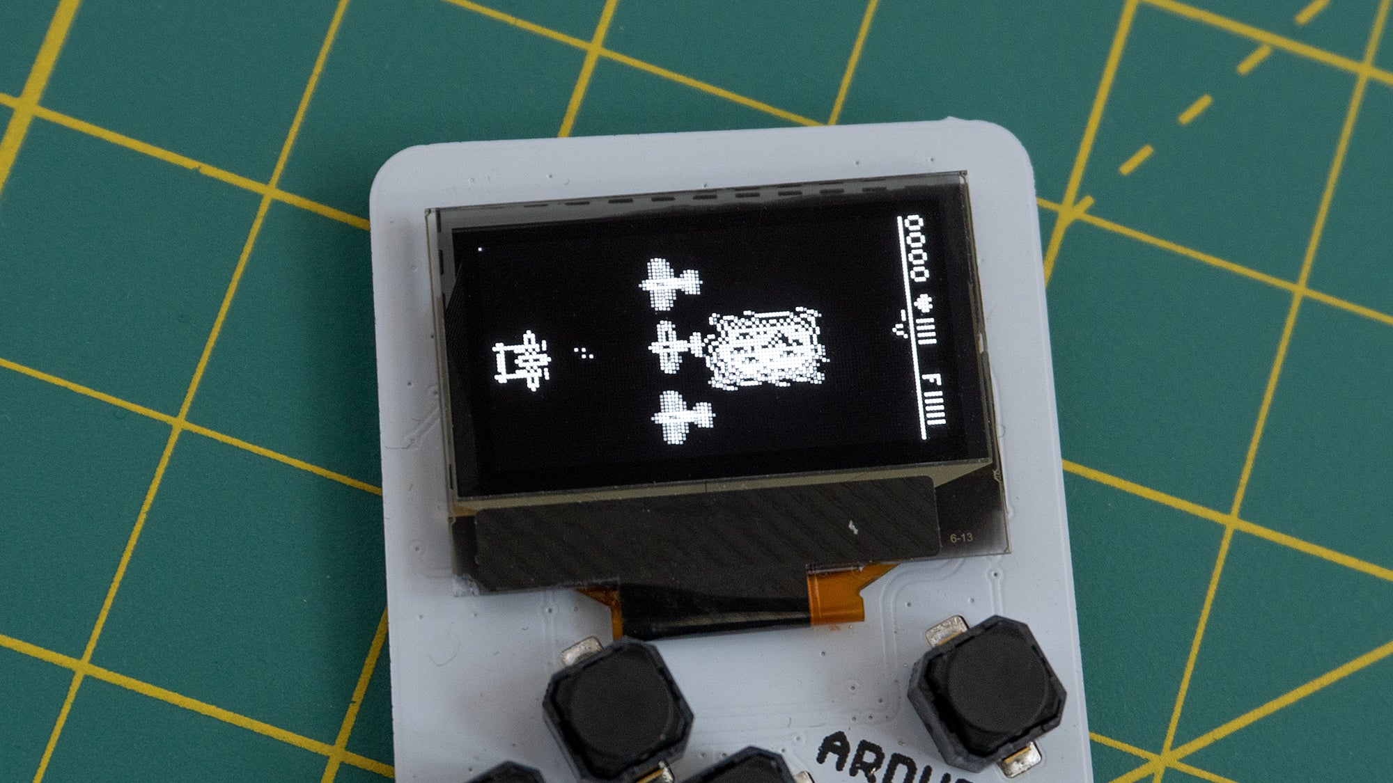 The Arduboy Mini uses a monochromatic OLED screen which can only display black and white images — no grayscale. (Photo: Andrew Liszewski | Gizmodo)