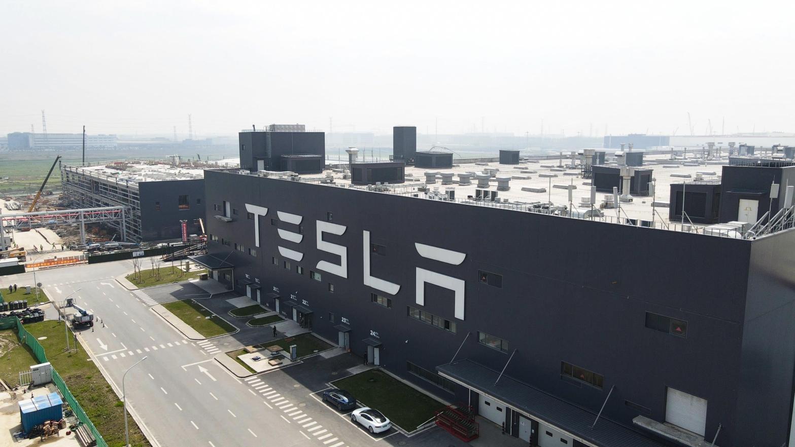 The Tesla production plant in Shanghai, China will be scaling back production this month and in January. (Photo: Xiaolu Chu, Getty Images)