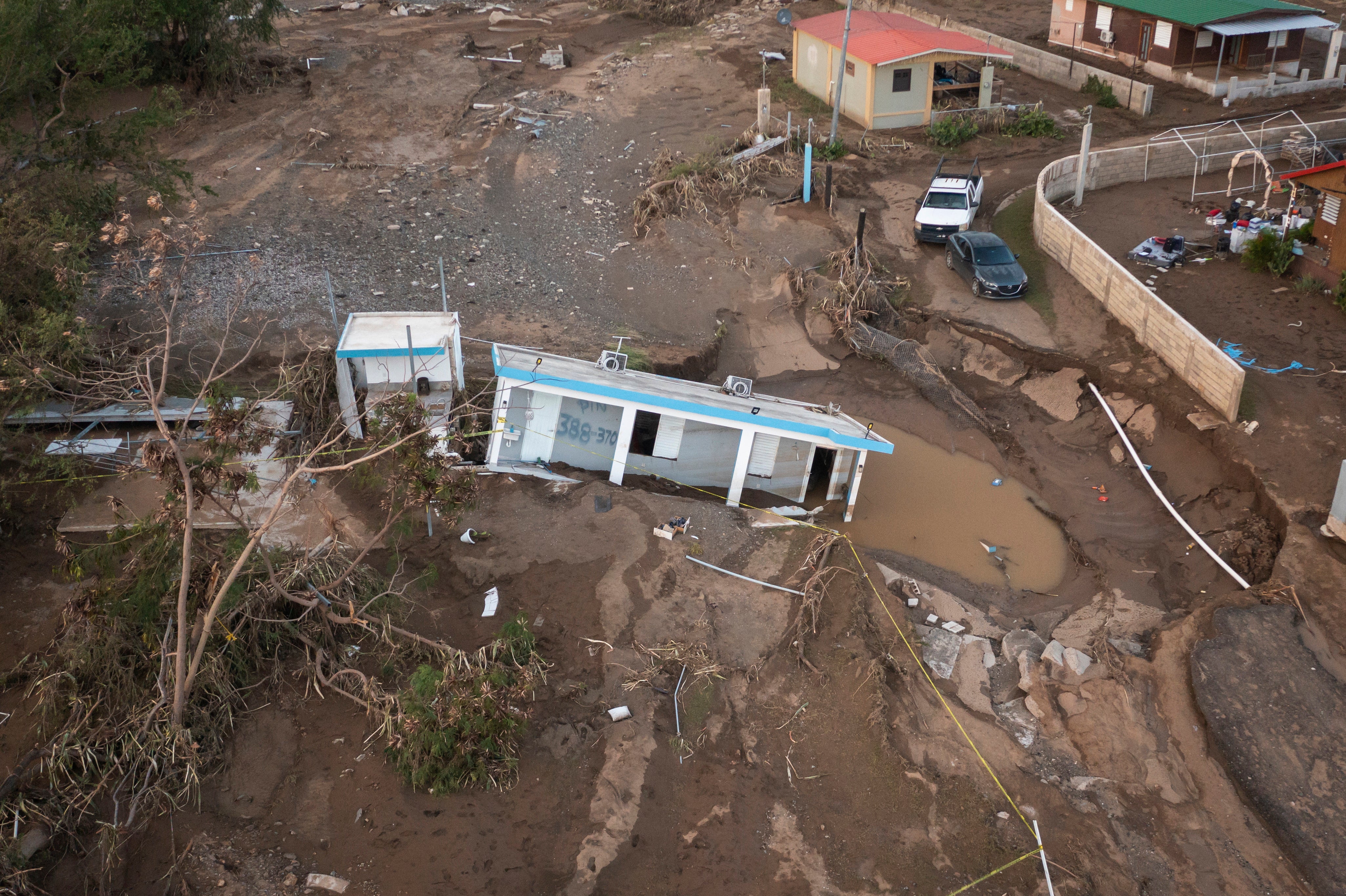 A house lays in the mud after it was washed away by Hurricane Fiona at Villa Esperanza in Salinas, Puerto Rico, Wednesday, Sept. 21, 2022. (Photo: Alejandro Granadillo, AP)