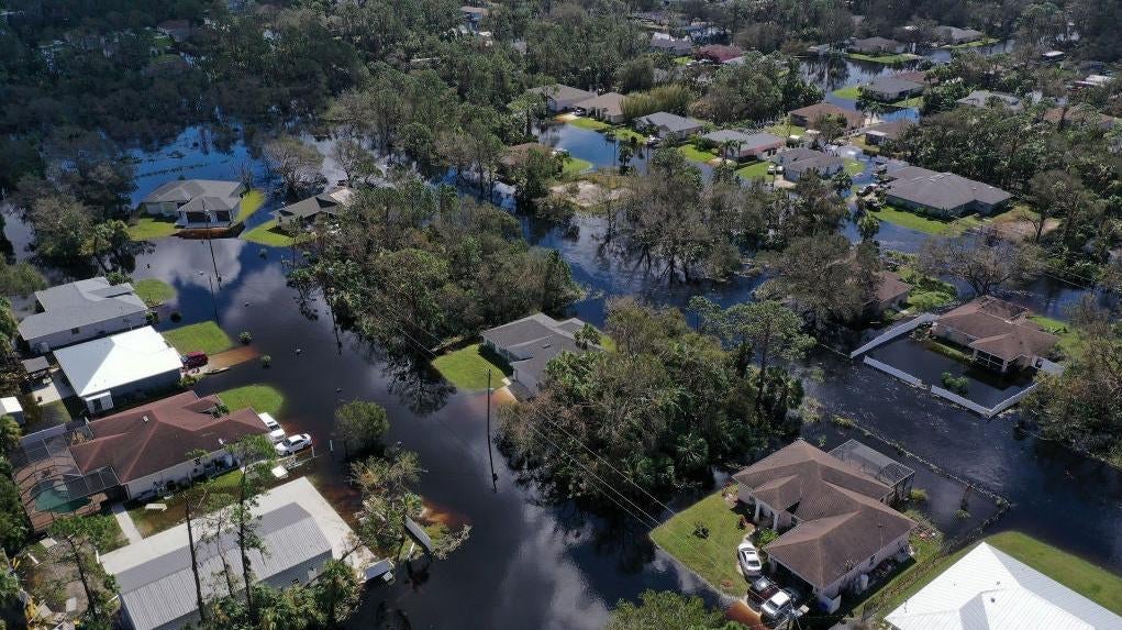 In this aerial view, a neighbourhood flooded by the rising Myakka River is shown in the wake of Hurricane Ian on October 01, 2022 in North Port, Florida. (Photo: Win McNamee, Getty Images)