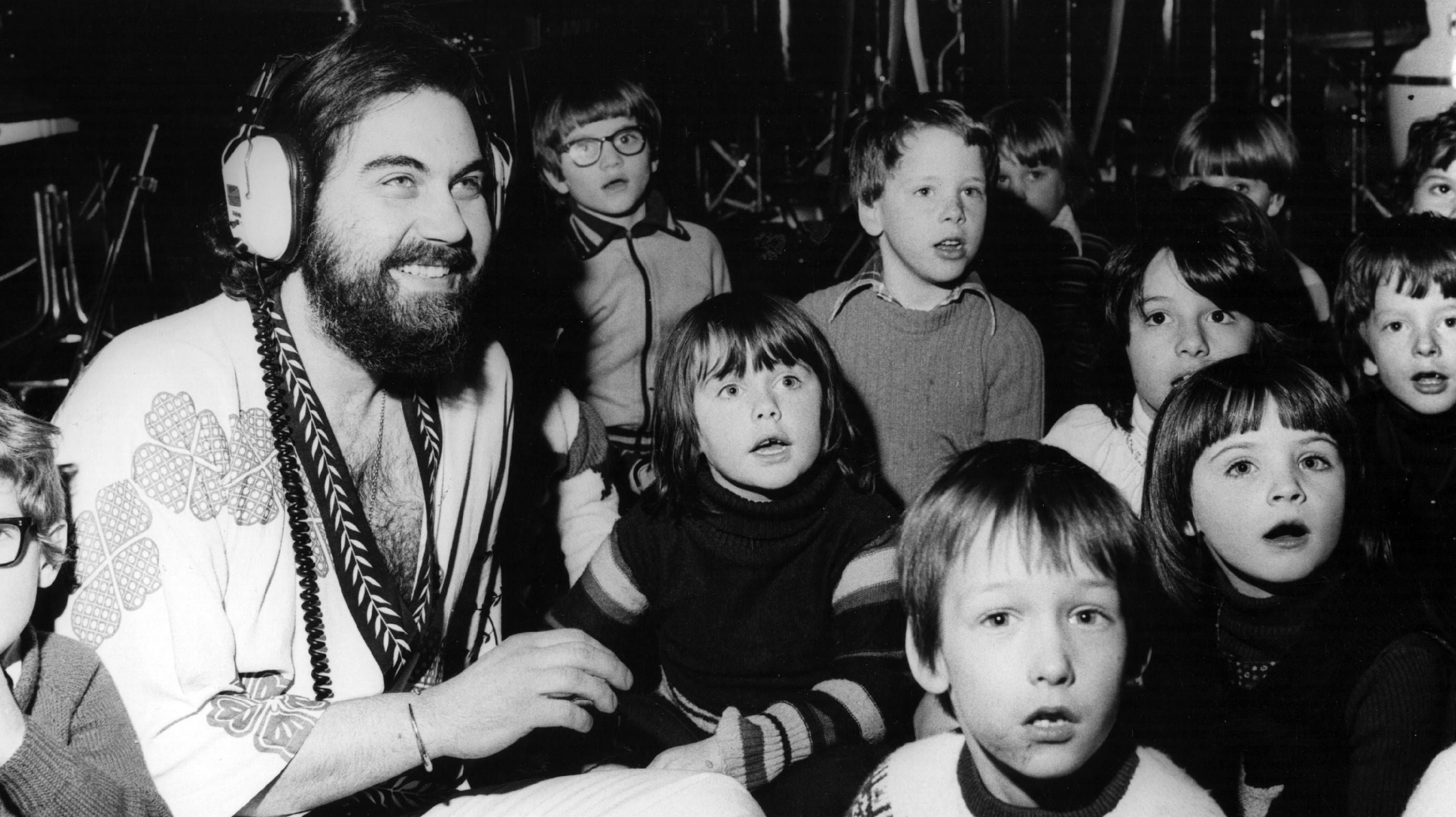 Evangalos Papathanassiou, better known as Vangelis, records a song with a group of children. (Photo: Fred Mott, Getty Images)
